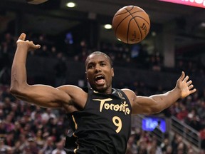 Serge Ibaka of the Raptors shows off his muscular upper body reacts after dunking against the Phoenix Suns on Feb. 21, 2020, at Scotiabank Arena. (DAN HAMILTON/USA Today Sports)