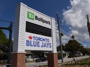 Signage at the entrance of TD Ballpark announced the game between the Yankees and Blue Jays was cancelled due to the coronavirus outbreak, in Dunedin, Fla., Sunday, March 15, 2020.