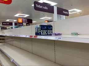 Empty shelves of toilet paper are seen are seen at a supermarket in London March 13, 2020. (REUTERS/Dylan Martinez/File Photo)