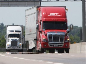 Transport trucks on Hwy. 401 in Kingston, Ont.