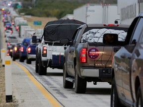 Cars with migrants queue to cross a checkpoint during the "12th Caravan of Migrants" in Sabinas Hidalgo, state of Nuevo Leon, Mexico December 17, 2019.