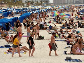 People crowd the beach, while other jurisdictions had already closed theirs in efforts to combat the spread of novel coronavirus disease (COVID-19) in Clearwater, Florida, U.S. March 17, 2020.  (REUTERS/Steve Nesius/File Photo)