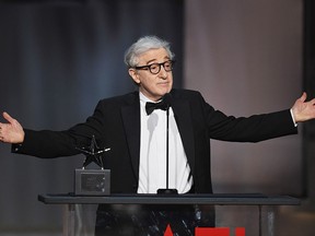 In this June 8, 2017, file photo, director-actor Woody Allen speaks onstage during American Film Institute's 45th Life Achievement Award Gala Tribute to Diane Keaton at Dolby Theatre in Hollywood, Calif.