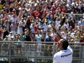 Mercedes driver Lewis Hamilton waves to the crowd during the drivers' parade at the Canadian Grand Prix in Montreal on June 9, 2019.