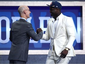 Zion Williamson poses with NBA Commissioner Adam Silver after being drafted with the first overall pick by the New Orleans Pelicans during the 2019 NBA Draft at the Barclays Center on June 20, 2019 in the Brooklyn borough of New York City.