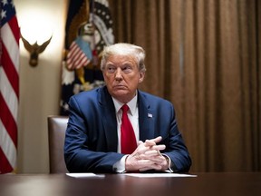 President Donald Trump listens during a meeting with healthcare executives in the Cabinet Room of the White House April 14, 2020 in Washington, D.C.