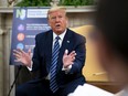 U.S. President Donald Trump answers questions while meeting with New Jersey Gov. Phil Murphy in the Oval Office of the White House April 30, 2020 in Washington, D.C.