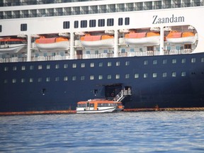Passengers board a lifeboat from Holland America Line cruise ship MS Zaandam to be transported to her sister ship Rotterdam on Panama Bay, Panama during a coronavirus disease (COVID-19) outbreak on March 28, 2020. (Panama Maritime Authority/Handout va REUTERS)