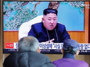 South Korean people watch a TV broadcasting a news report on North Korean leader Kim Jong Un in Seoul, South Korea, April 21, 2020.