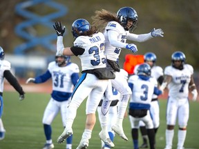 Montreal Carabins Reda Malki (left) and Marc-Antoine Dequoy celebrate a touchdown. Dequoy, a 25-year-old defensive back from the University of Montreal Carabins, turned down two other offers to become a Green Bay Packer on Saturday, sources say.