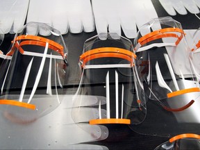 New 3D-printed face shields to be used by medical professionals in the fight against coronavirus, disease (COVID-19), made by Maker Nexus sit on a table in the nonprofit's office in Sunnyvale, Calif., on April 1, 2020. (REUTERS/Nathan Frandino)