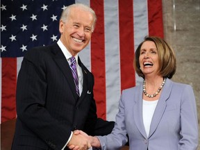 In this file photo taken on January 27, 2010 US Vice President Joe Biden (L) and Speaker of the House Nancy Pelosi shake hands during a State of the Union speech.