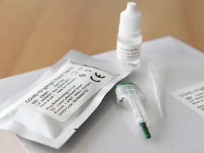 A photo taken on March 31, 2020 shows a COVID-19 rapid test kit at the World Health Laboratories in Bunnik, The Netherlands, after the laboratory received a trial shipment from China, amid concerns over the spread of the COVID-19 (novel coronavirus). (PIROSCHKA VAN DE WOUW/ANP/AFP via Getty Images)