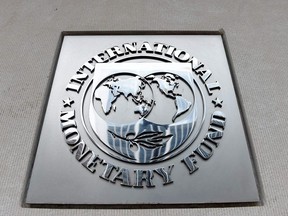 In this file photo an exterior view of the building of the International Monetary Fund (IMF), with the IMG logo, is seen on March 27, 2020 in Washington, DC.
