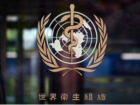 This picture taken on April 15, 2020 shows a sign of the World Health Organization (WHO) written in Chinese at the entrance of their headquarters in Geneva amid the COVID-19 outbreak, caused by the novel coronavirus.