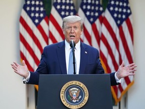In this file photo taken on April 15, 2020 US President Donald Trump gestures as he speaks during the daily briefing on the novel coronavirus, which causes COVID-19, in the Rose Garden of the White House, in Washington, DC.