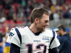 In this file photo former Quarterback for the New England Patriots Tom Brady (12) speaks with running back for the New England Patriots James White (out of frame) before the Super Bowl LIII between the New England Patriots and the Los Angeles Rams at Mercedes-Benz Stadium in Atlanta, Georgia, on February 3, 2019.