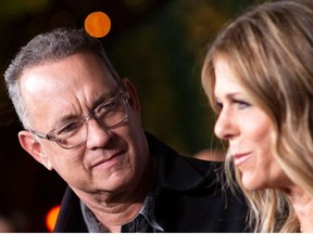 In this file photo taken on November 07, 2018 Actors Tom Hanks (L) and his wief actress/singer Rita Wilson attend "JONI 75: A Birthday Celebration" Live at the Dorothy Chandler Pavilion in Los Angeles on November 7, 2018.