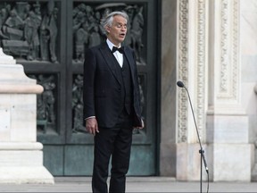 Italian tenor and opera singer Andrea Bocelli sings during a rehearsal on a deserted Piazza del Duomo in central Milan on April 12, 2020.