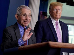National Institute of Allergy and Infectious Diseases director Dr. Anthony Fauci speaks as U.S. President Donald Trump listens during the coronavirus response daily briefing at the White House in Washington, U.S., April 10, 2020.