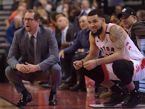 Toronto Raptors head coach Nick Nurse and guard Fred VanVleet (23) watch play against Chicago Bulls in the first half at Scotiabank Arena.