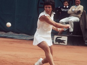 Billie Jean King hits a backhand to her opponent during the Women's singles final at the French tennis Open in Paris in 1972.