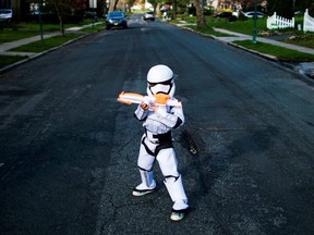 Reuben Goodman poses for a picture during his 5th birthday party in an empty street as the outbreak of the coronavirus disease (COVID-19) continues in South Orange, N.J. April 14, 2020.