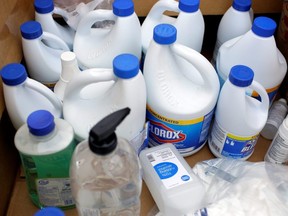 A view of the product as volunteers with Project C.U.R.E. accept bottles of bleach and hand sanitizer to be donated to healthcare workers treating COVID-19 in Chicago, March 29, 2020.
