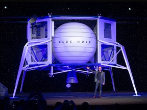In this May 9, 2019, file photo, Amazon CEO Jeff Bezos announces Blue Moon, a lunar landing vehicle for the Moon, during a Blue Origin event in Washington, D.C.