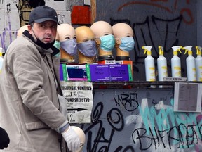 A grey market salesman sells face masks and hand sanitizer at a street corner in Sarajevo, on April 22, 2020.