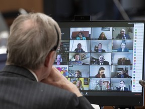 Canadian Members of Parliament are shown on a monitor during a virtual session of the House of Commons Tuesday, April 28, 2020 in Ottawa.