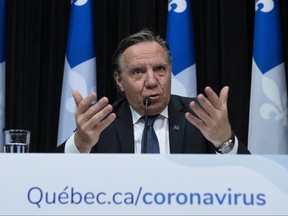 Quebec Premier Francois Legault responds to reporters during a news conference on the COVID-19 pandemic, Friday, April 17, 2020 at the legislature in Quebec City. (THE CANADIAN PRESS/Jacques Boissinot)