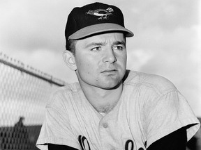 This is a 1959 file photo showing Baltimore Orioles minor league pitcher Steve Dalkowski posed in Miami, Fla. Dalkowski, a hard-throwing, wild left-hander who inspired the creation of the character Nuke LaLoosh in the movie "Bull Durham" but never pitched in a big league game, died April 19, 2020, at the Hospital of Central Connecticut in New Britain. He was 80.