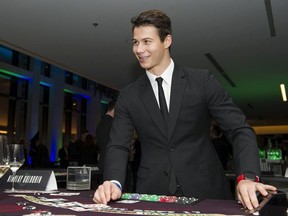 Vancouver Canucks winger Nikolay Goldobin deals blackjack at the club's annual fundraiser, the Dice & Ice Gala, in February 2019.
