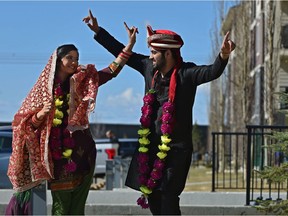 Gaurav Sapra and Megha Sharma dance outside their home on Friday, April 24, 2020, after they were married in Edmonton and held the ceremony over Zoom to include family members due to physical distancing in Edmonton on April 17, 2020.