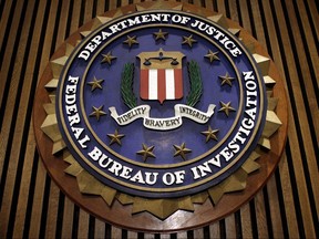 The seal of the FBI hangs in the Flag Room at the bureau's headquaters March 9, 2007 in Washington. (Chip Somodevilla/Getty Images)