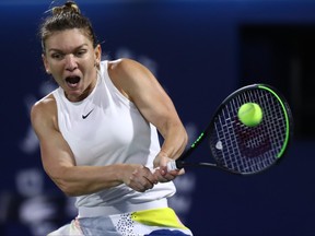 Simona Halep of Romania plays a backhand against Elena Rybakina of Kazakhstan during their Women's Singles Final match of the WTA Dubai Duty Free Tennis Championship on Day Six of the Dubai Duty Free Tennis at Dubai Duty Free Tennis Stadium on February 22, 2020 in Dubai, United Arab Emirates. (Francois Nel/Getty Images)