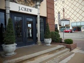 A closed sign is seen in the entrance of the J. Crew store at Country Club Plaza as the Coronavirus Pandemic causes a climate of anxiety and changing routines in America on April 2, 2020 in Kansas City, Miss.