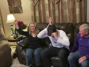 In this still image from video provided by the NFL, LSU quarterback Joe Burrow puts on a Cincinnati Bengals cap after being selected first overall during the first round of the 2020 NFL Draft on April 23, 2020. (Photo by NFL via Getty Images)