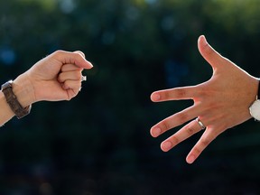 The fighting of two hand with rock and paper symbol