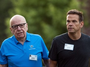 Rupert Murdoch, left, executive chairman of News Corp and chairman of Fox News, and Lachlan Murdoch, co-chairman of 21st Century Fox, walk together as they arrive on the third day of the annual Allen & Company Sun Valley Conference, July 13, 2017 in Sun Valley, Idaho.