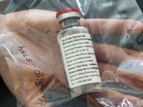 In this file photo one vial of the drug remdesivir is viewed during a press conference in Hamburg, Germany on April 8, 2020.