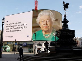 A message from Britain's Queen Elizabeth II is displayed on a screen in Piccadilly Circus, as the spread of the coronavirus disease (COVID-19) continues, London, Britain, April 19, 2020.