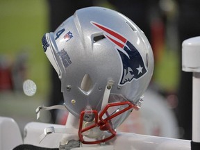 A New England Patriots helmet rest on the sidelines during the first quarter of the AFC Championship game against the Kansas City Chiefs at Arrowhead Stadium.
