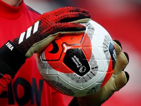 General view of a match ball held by Manchester United's David de Gea during the warm up before the match.