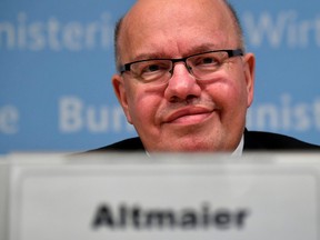 German Economy Minister Peter Altmaier listens during a news conference on the economic situation amid the coronavirus disease (COVID-19) outbreak, in Berlin, Germany April 17, 2020.
