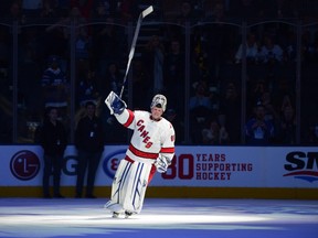 Emergency goaltender David Ayres skates a lap after being named the game's first star after they beat the Toronto Maple Leafs 6-3 in NHL hockey action in Toronto, Saturday, Feb. 22, 2020.