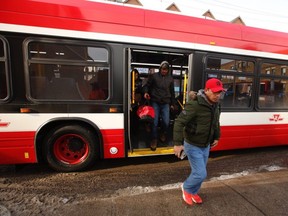 People disembark at Jane and Bloor Sts. from shuttle buses after a TTC subway car near Keele St. came off the rails on Wednesday, Jan. 22, 2020.