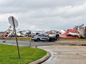 Damaged planes and buildings are seen in the aftermath of a tornado in Monroe, Louisiana, Sunday, April 12, 2020, in this still image obtained from social media.
