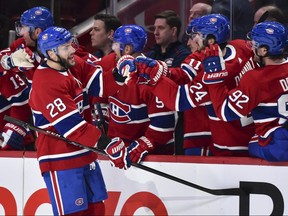 Marco Scandella (28) of the Montreal Canadiens celebrates with teammates on the bench at the Bell Centre on February 8, 2020 in Montreal. (Minas Panagiotakis/Getty Images)